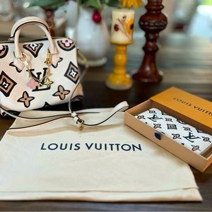 Louis Vuitton handbag, wallet and charms, like new no marks perfect condition.